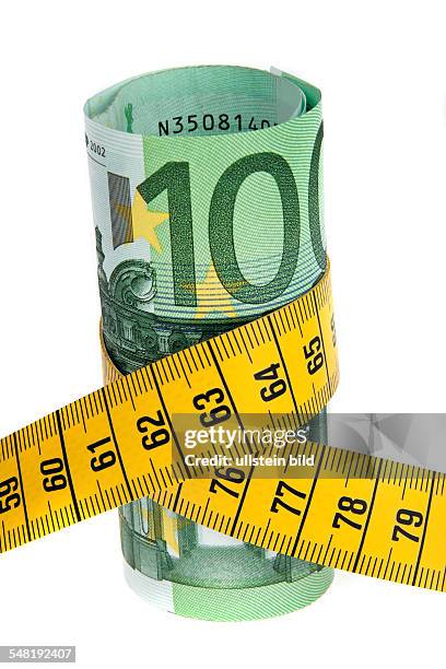 Symbolic photo austerity, Euro banknotes with measuring tape