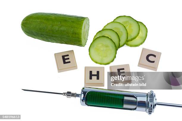 Symbolic photo EHEC epidemic, cucumber, letters and injection