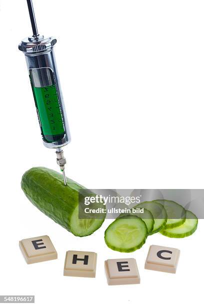 Symbolic photo EHEC epidemic, cucumber, letters and injection