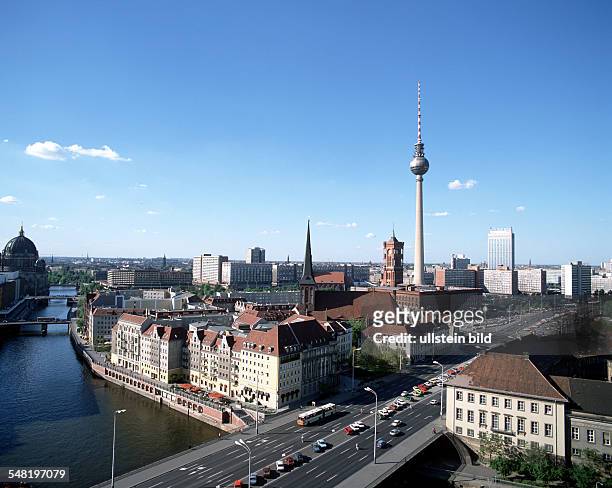 German Democratic Republic Bezirk Berlin East Berlin - The quarter "Nikolaiviertel" at river "Spree" with television tower in the background.