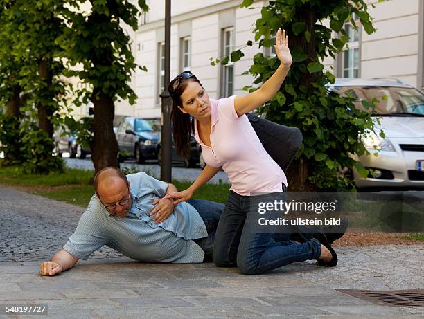 Symbolic photo heart attack, woman is seeking aid -