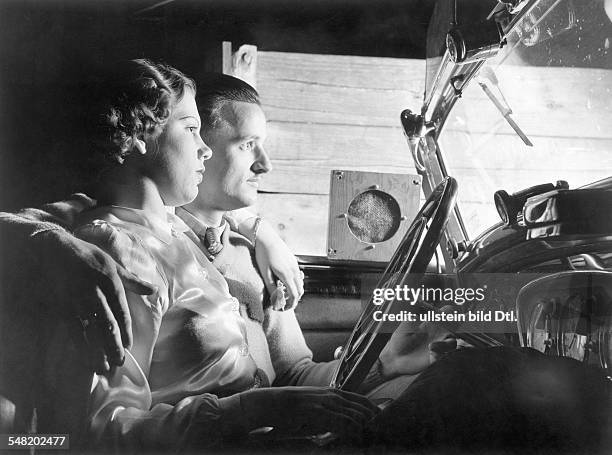 California young couple , visitors of a drive-in cinema 1938 BIZ 9/1938