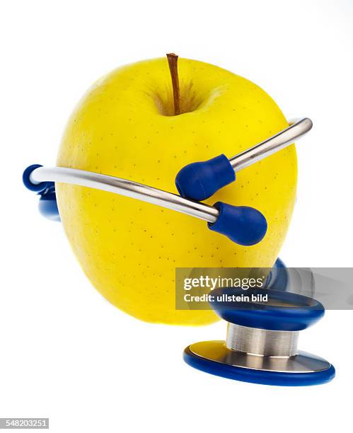 Symbolic photo healthy eating, stethoscope and apple