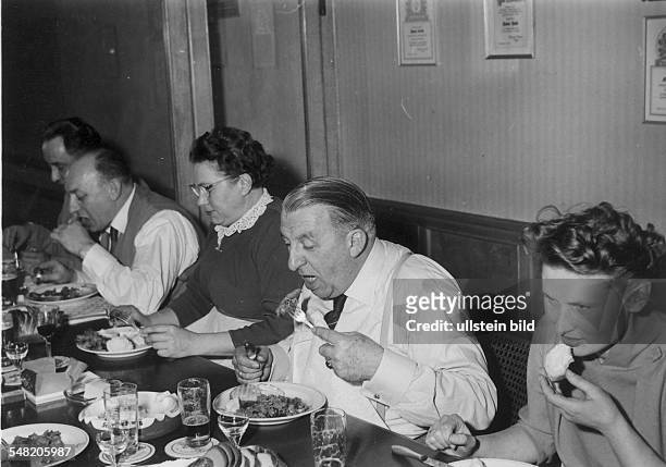 Germany; people during a family party in a restaurant - around 1950