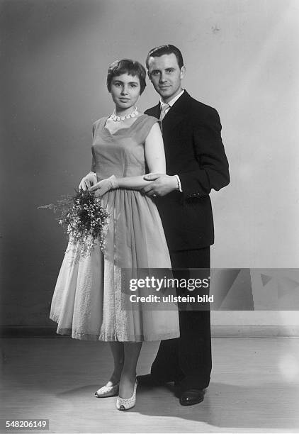 Germany; couple wearing feastful clothes - 1955