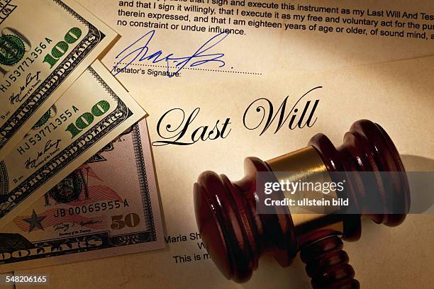 Last will, dollar banknotes and gavel