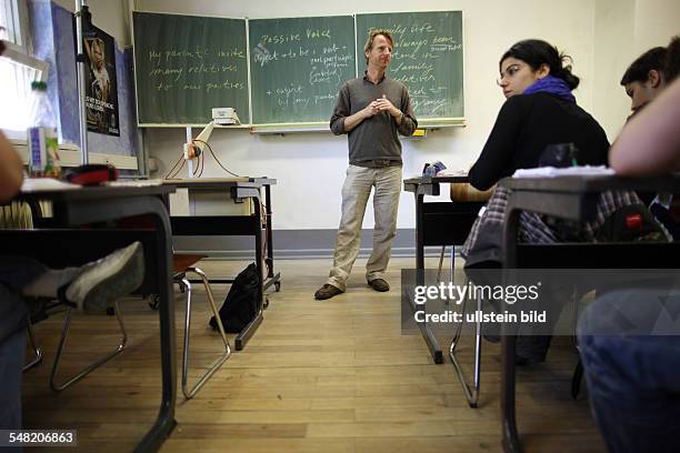 Germany Berlin - students and teacher at school -