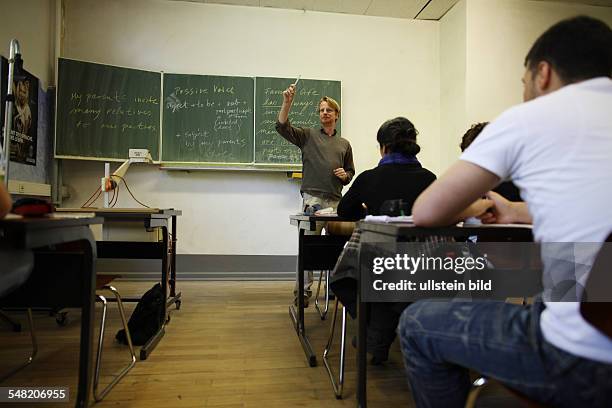 Germany Berlin - students and teacher at school -