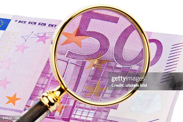 Euro banknote seen through a lense
