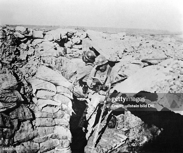 French soldiers in a trench are having a rest from fighting