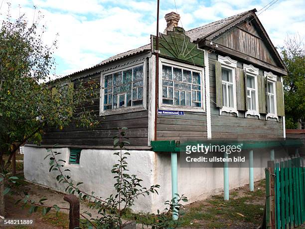 Russia Rostov on Don - Novocherkassk - typical old wooden house with concrete flood protection base