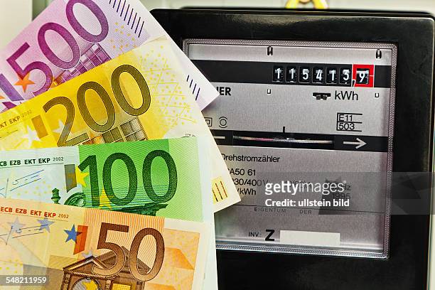 Symbolic photo electricity rate, electricity meter and Euro banknotes