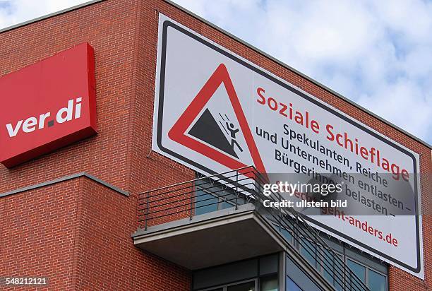 Germany Berlin Mitte - poster social imbalance at headquarters of the trade union ver.di