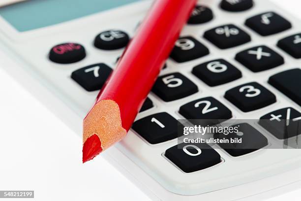 Red pencil and calculator