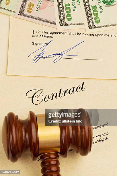 Contract, dollar banknotes and gavel