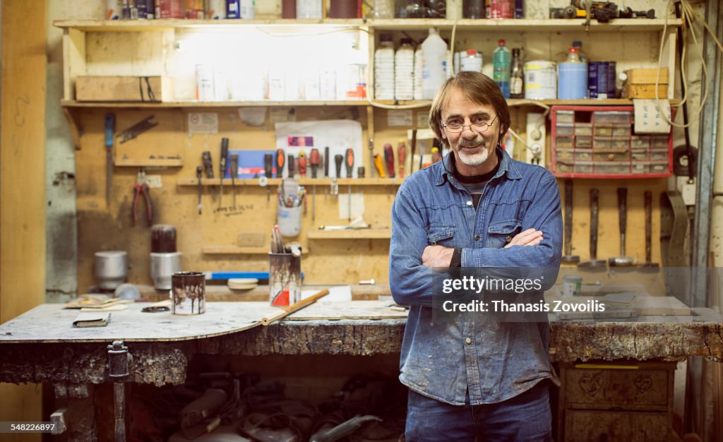 Caucasian carpenter in workshop