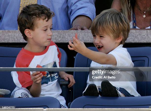 Andre Agassi's son, Jaden Agassi, right, laughs with another child as his dad competes in the fourth round against Xavier Malisse of Belgium during...