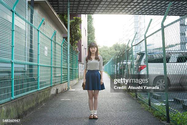 japanese woman standing on street - before the 24 stock pictures, royalty-free photos & images