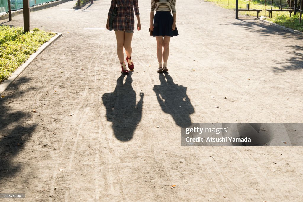 Japanese women walking on street,rear view