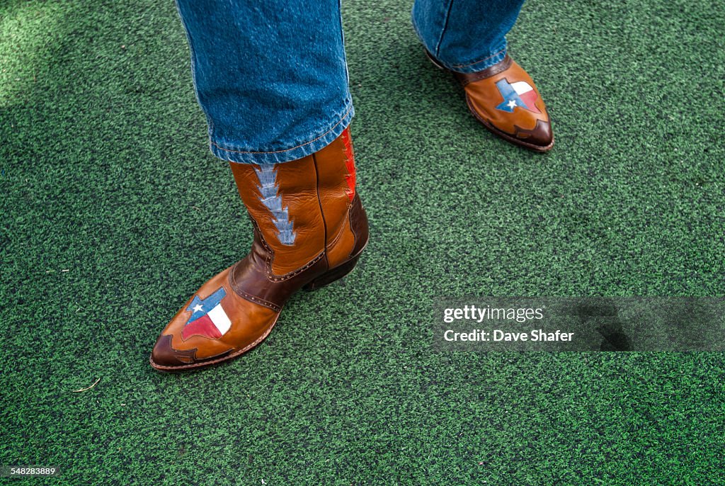 A Texan displays his pride of the lone star state with his custom cowboy boots.