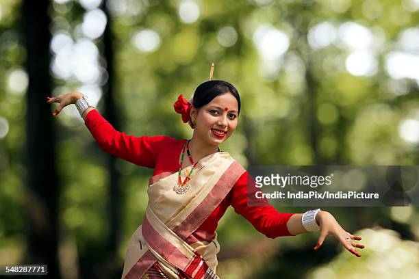 portrait of woman doing bihu dance - bihu stock pictures, royalty-free photos & images