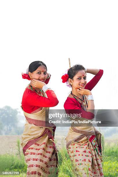 portrait of women performing bihu dance - bihu stock pictures, royalty-free photos & images