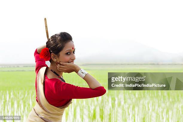 woman performing bihu dance - bihu stock pictures, royalty-free photos & images