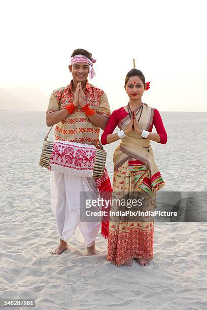 portrait of bihu dancers greeting - bihu stock pictures, royalty-free photos & images