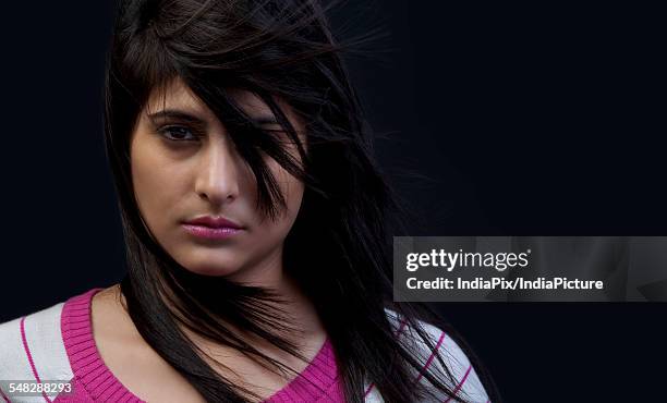 portrait of a woman - woman with hair blowing over face stock pictures, royalty-free photos & images