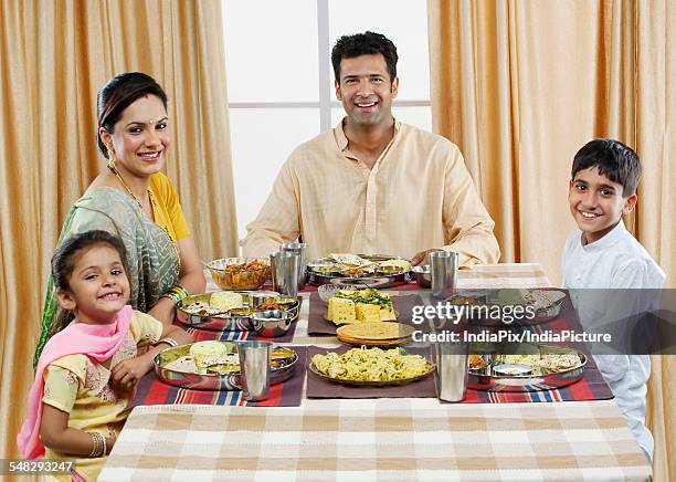 gujarati family having lunch - pulao stock pictures, royalty-free photos & images