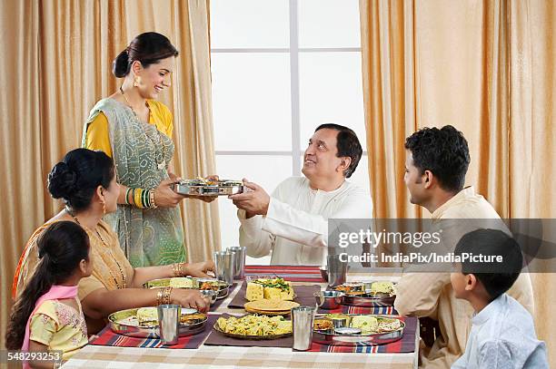 gujarati family having lunch - navratri stock pictures, royalty-free photos & images
