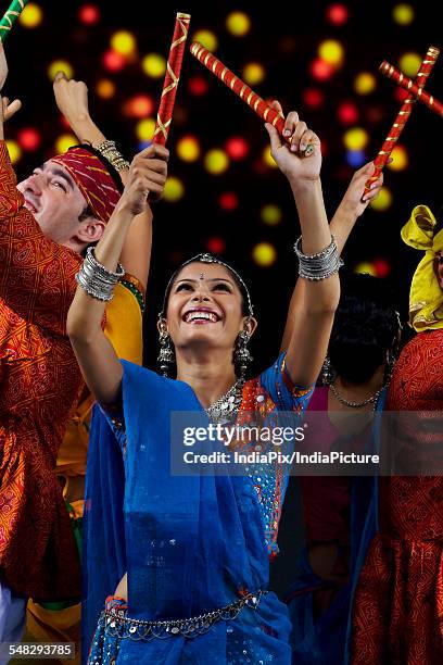 people performing dandiya - dandiya ストックフォトと画像