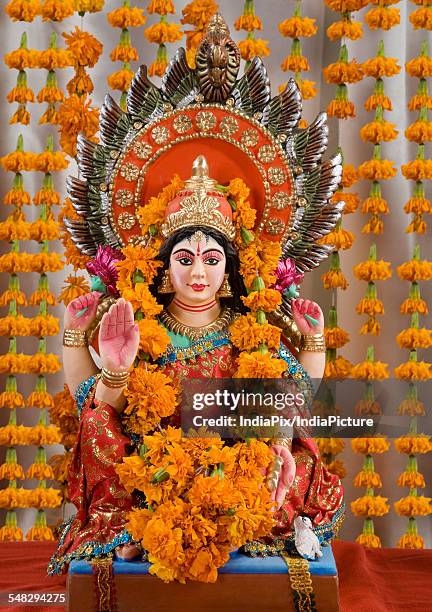 lakshmi idol - lakshmi puja stock pictures, royalty-free photos & images