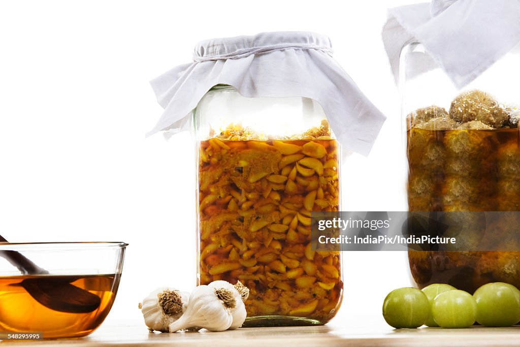 Jars filled with garlic and gooseberry pickle