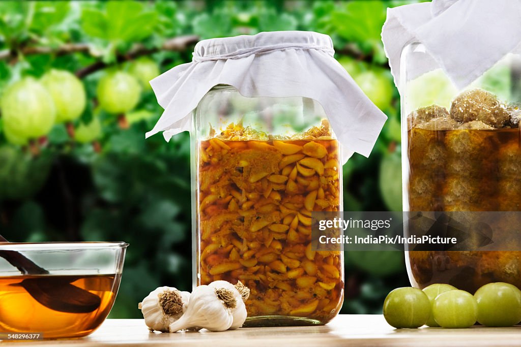 Jars filled with garlic and amla pickle
