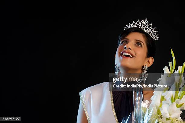 beauty queen with a bouquet of flowers - beauty queen crown stock pictures, royalty-free photos & images