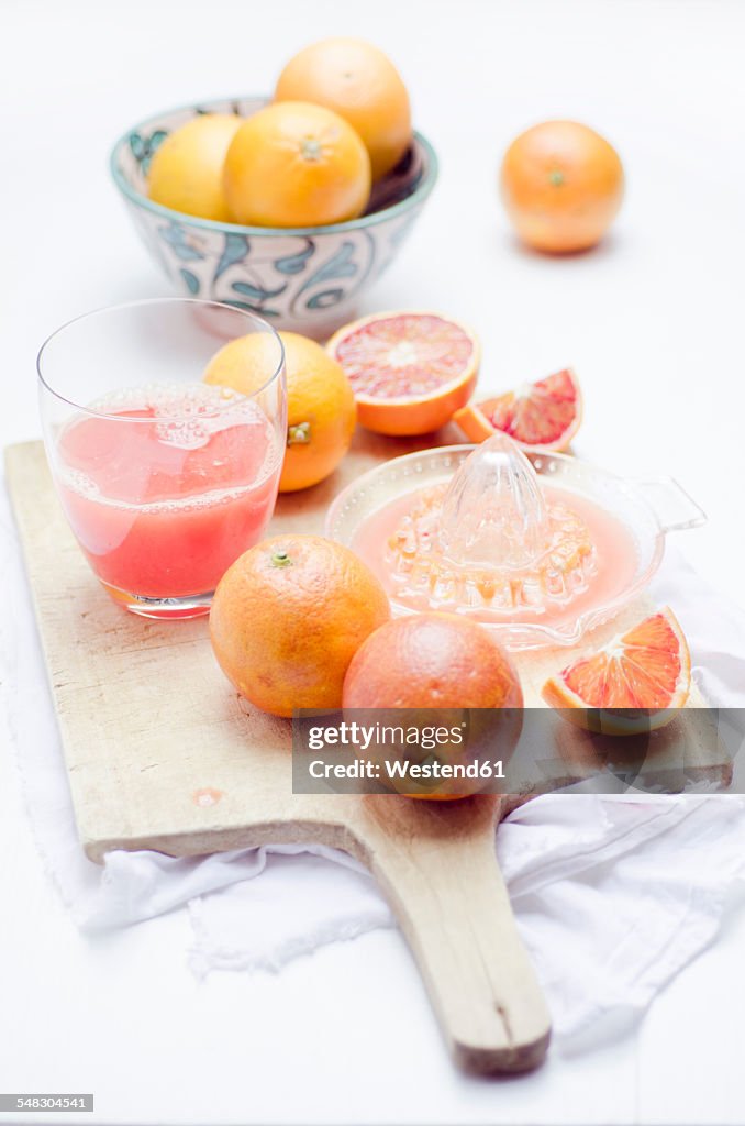 Freshly squeezed blood orange juice with blood oranges