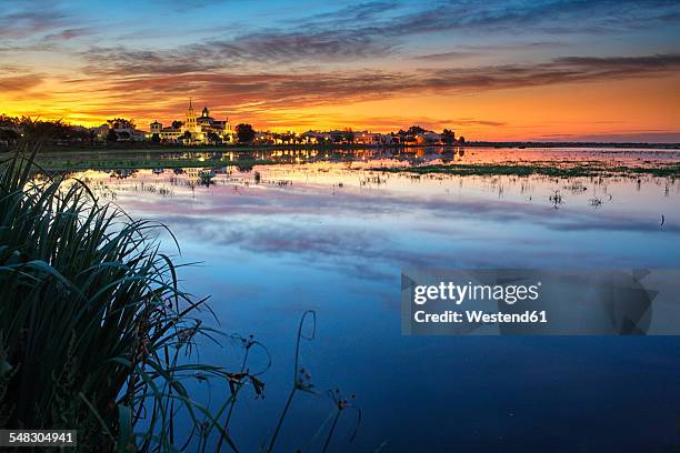 spain, andalusia, huelva province, donana national park, el rocio village at guadalquivir river - parque nacional de donana stock pictures, royalty-free photos & images