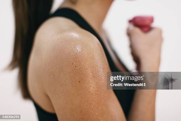 sweaty shoulder of woman doing fitness workout - weight off shoulder stock pictures, royalty-free photos & images