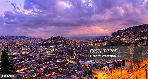 ecuador, quito, cityscape with el panecillo at sunset - quito stock pictures, royalty-free photos & images
