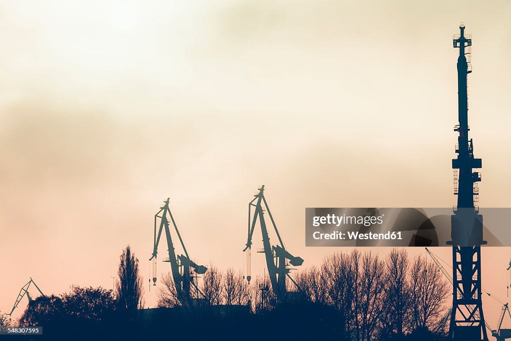 Germany, Hamburg, harbor facility in the evening