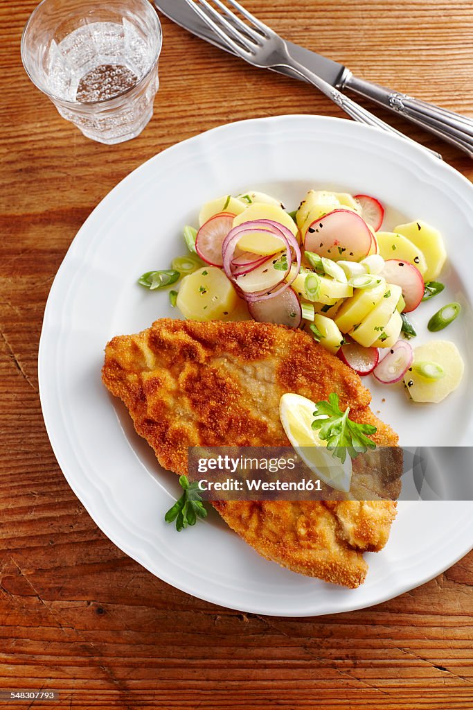 Dish of escalope and fried potatoes