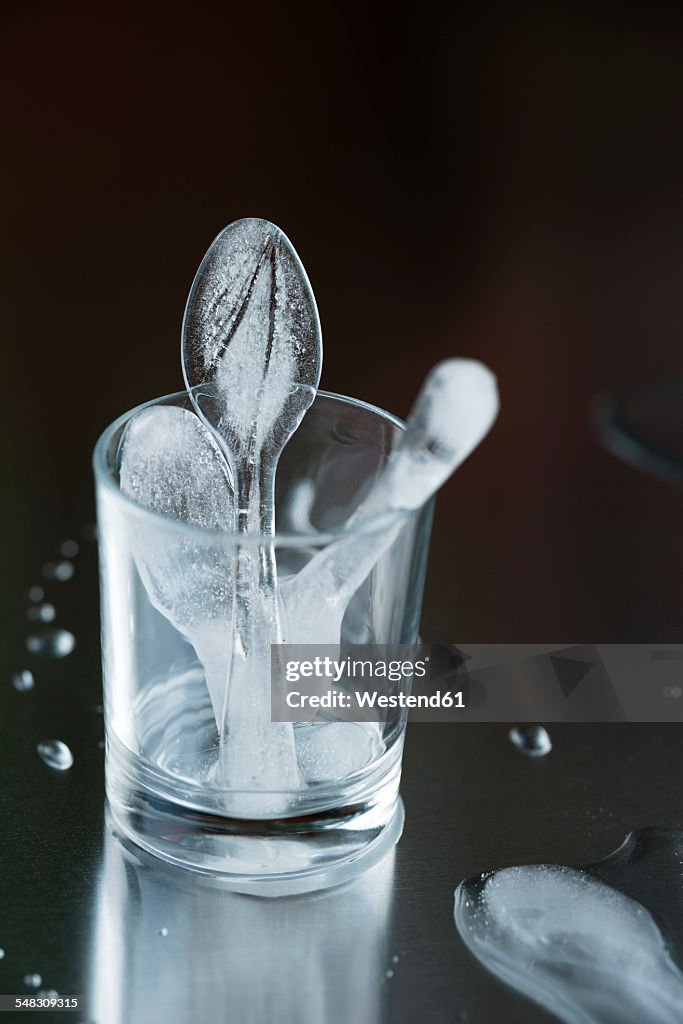 Glass with ice formed like spoons