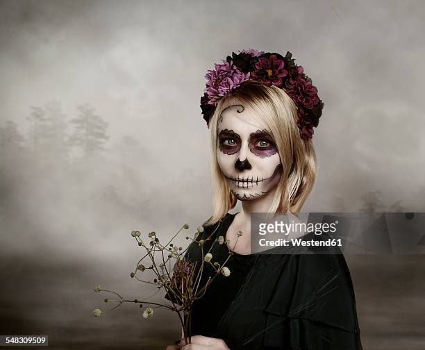 portrait of woman with sugar skull makeup - wearing flowers stock pictures, royalty-free photos & images