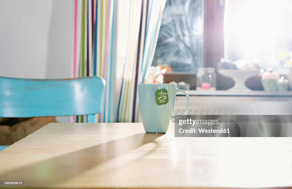 Cup of tea standing on kitchen table