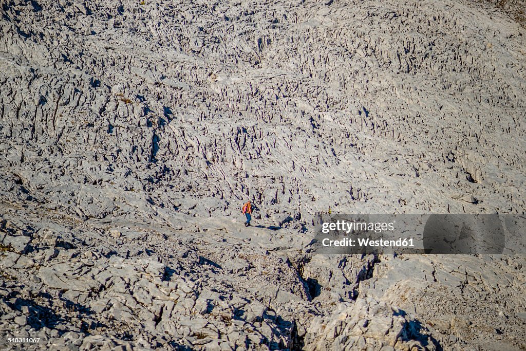 Austria, Allgaeu Alps, Little Walser Valley, man hiking at Gottesacker