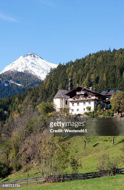 austria, east tyrol, oberpeischlach, chapel maria heimsuchung and deferegg alps in autumn - osttirol stock pictures, royalty-free photos & images