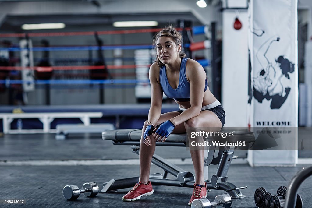 Athlete in gym having a break