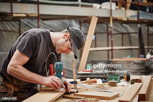 boat building craftsmen - laborer stock pictures, royalty-free photos & images