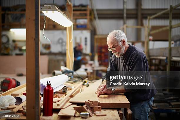 boat building craftsmen - investing for retirement imagens e fotografias de stock